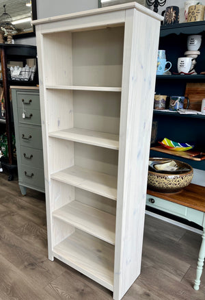 White washed bookshelf